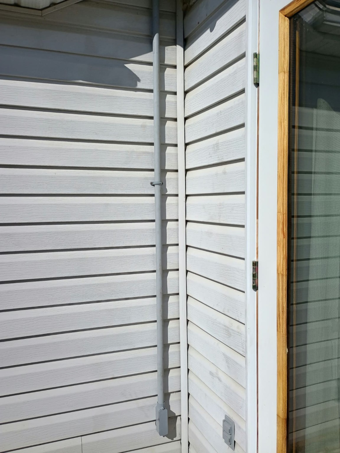 Clean exterior Schedule 40 conduit cable run by Ready Tech Construction