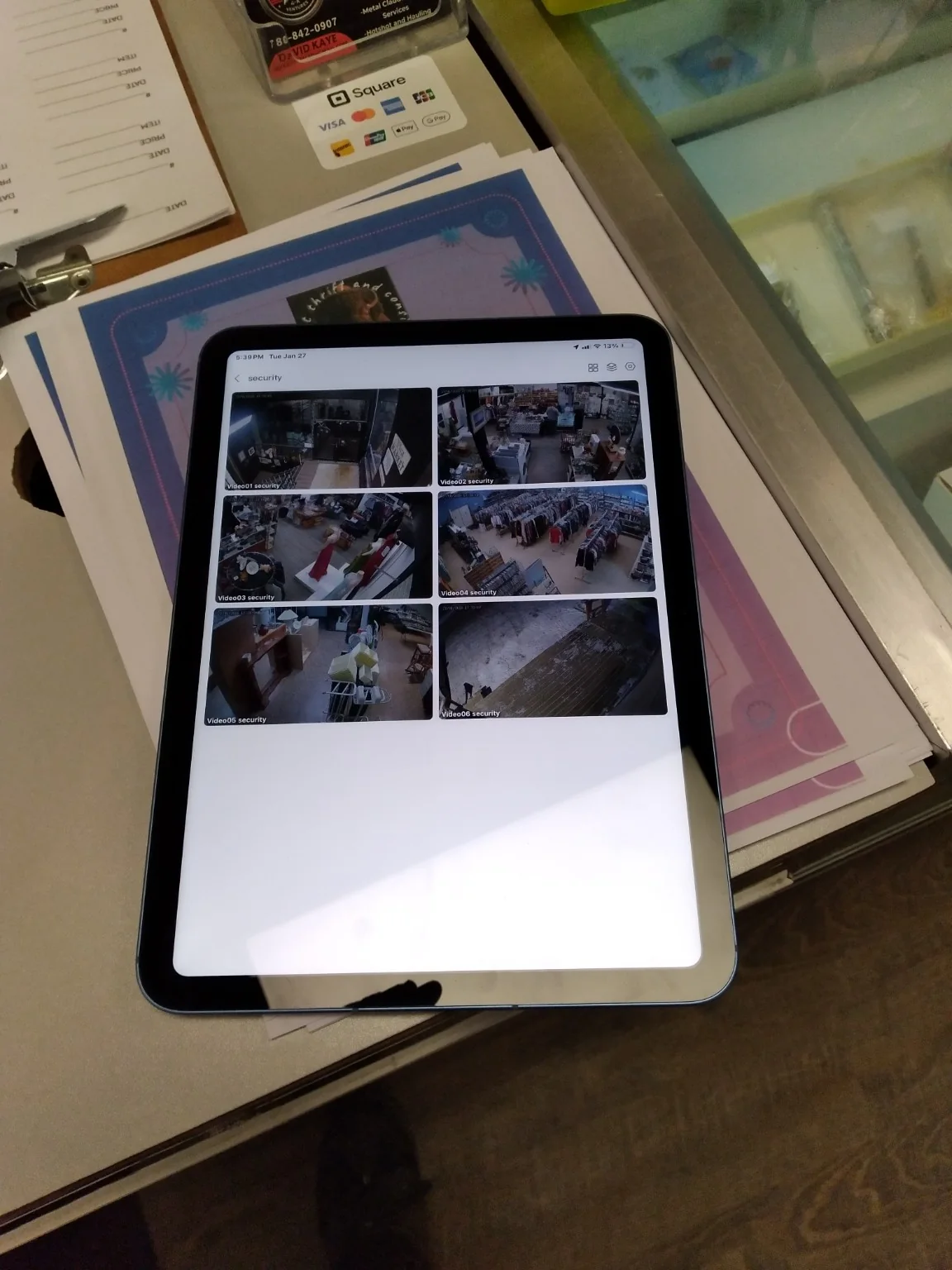 Ready Tech commercial security camera views displayed remotely on a tablet